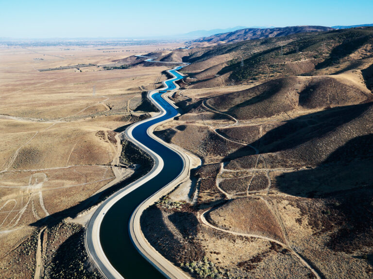 A long winding canal in a desert like environment.