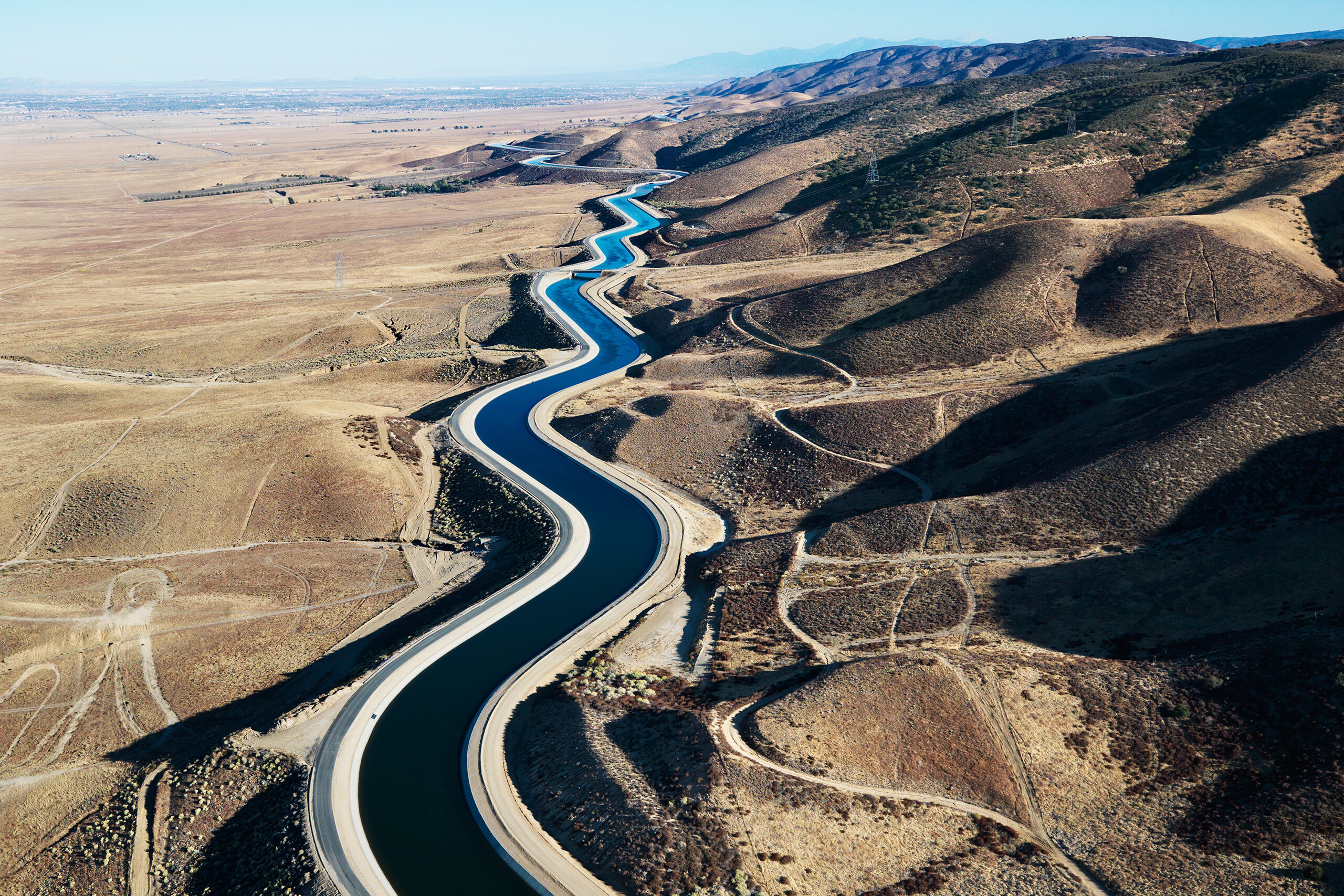 A snaking canal in a desert like environment.